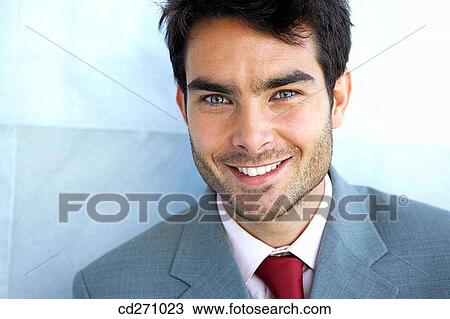 Stock Image - black hair, blue eyes, business, businessman, businesspeople. Fotosearch