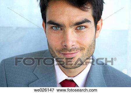Stock Photo - black hair, blue eyes, business, businessman, businesspeople. Fotosearch