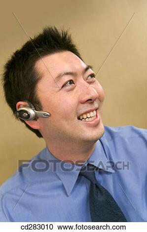 Bluetooth, businesspeople, businessman, business, Asian View Large Photo Image Stock Image - Bluetooth, businesspeople, businessman, business, Asian. Fotosearch