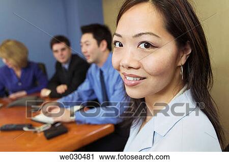 Stock Image - board-room, businesspeople, business, Asian. Fotosearch