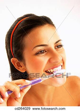Stock Photo - Body care, Brush teeth, brush, brunette, activity. Fotosearch