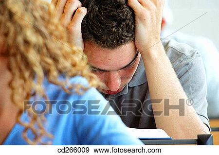 Stock Photo - book, classroom, boy, adolescence. Fotosearch