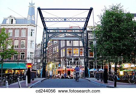 Bridge on canal, Kloveniersburgwal. Amsterdam. Netherlands View Large Photo Image Stock Photograph - Bridge on canal, Kloveniersburgwal. Amsterdam. Netherlands. Fotosearch