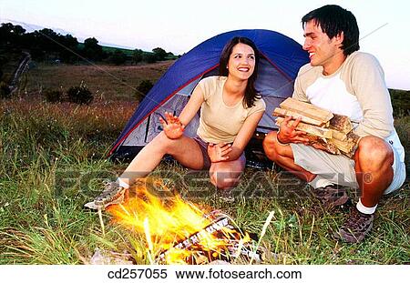 burning, camping, campfire, camp, 20's View Large Photo Image Stock Photography - burning, camping, campfire, camp, 20's. Fotosearch