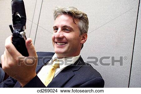 business, businessman, businesspeople, cell phone, contemporary View Large Photo Image Picture - business, businessman, businesspeople, cell phone, contemporary. Fotosearch