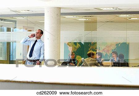 Stock Photo - business, businessman, businesspeople, businesswoman, calling. Fotosearch