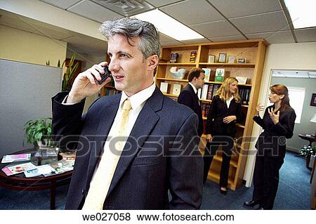 Stock Photo - business, businessman, businesspeople, calling, cell phone. Fotosearch