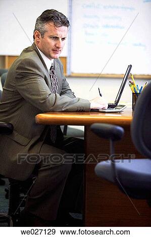 Stock Photo - business, businessman, businesspeople, computer, contemporary. Fotosearch