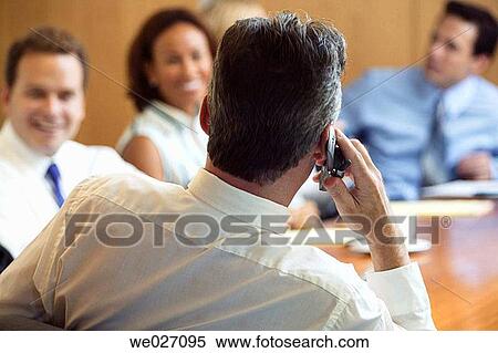 Stock Photography - business, businessman, businesspeople, businesswoman, cell phone. Fotosearch