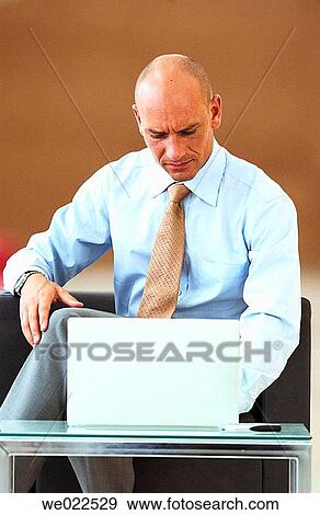 Stock Photo - business, businesspeople, businessman, 30's. Fotosearch