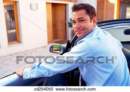 Businessman leaving home to work View Large Photo Image Stock Image - Businessman leaving home to work. Fotosearch