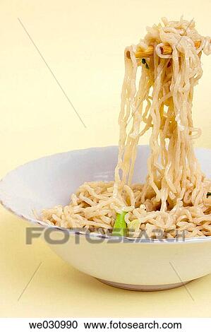 Chinese noodles hold on chop sticks View Large Photo Image Stock Image - Chinese noodles hold on chop sticks. Fotosearch