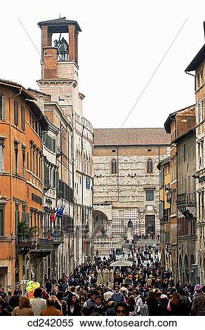 Corso Vannucci to Piazza Quattro Novembre: on the left, Palazzo dei Priori (aka Palazzo Comunale, town hall) and cathedral in background. Perugia. Umbria, Italy View Large Photo Image Stock Photography - Corso Vannucci to Piazza Quattro Novembre: on the left, Palazzo dei Priori (aka Palazzo Comunale, town hall) and cathedral in background. Perugia. Umbria, Italy. Fotosearch