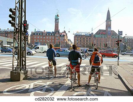 Cyclists waiting to cross Hans Christian Andersen Boulevard from Vesterbrogade. Radhuspladsen in front, Copenhagen, Denmark View Large Photo Image Stock Image - Cyclists waiting to cross Hans Christian Andersen Boulevard from Vesterbrogade. Radhuspladsen in front, Copenhagen, Denmark. Fotosearch