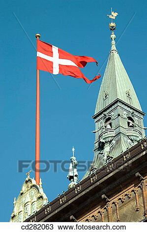 Stock Image - Danish pennant flying on Town Hall roof, Copenhagen, Denmark. Fotosearch