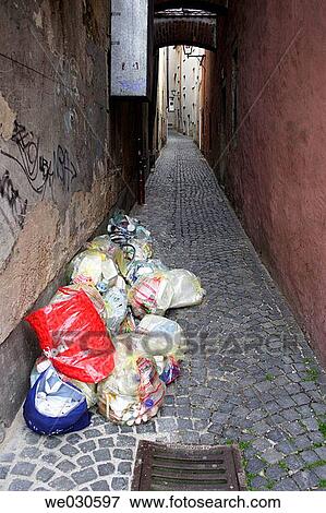 Heap of sacks with recycable waste in medieval street, Ratisbone / Regensburg, Upper Palatinate, Bavaria, Germany View Large Photo Image Stock Photo - Heap of sacks with recycable waste in medieval street, Ratisbone / Regensburg, Upper Palatinate, Bavaria, Germany. Fotosearch