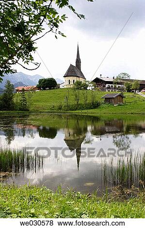 Lake with reflection of a church, Inzell, Chiemgau, Upper Bavaria, Bavaria, Germany View Large Photo Image Stock Photo - Lake with reflection of a church, Inzell, Chiemgau, Upper Bavaria, Bavaria, Germany. Fotosearch