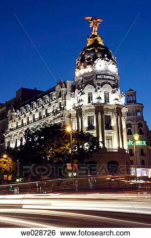 Stock Photograph - Metropolis building at night, Calle de Alcalß and Gran Via street corner. Madrid, Spain. Fotosearch