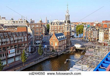 Munttoren (Mint Tower, 1620), Muntplein y Singel canal. Amsterdam. Netherlands View Large Photo Image Stock Image - Munttoren (Mint Tower, 1620), Muntplein y Singel canal. Amsterdam. Netherlands. Fotosearch