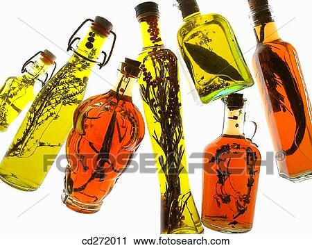 Oil olive and vinegars with aromatic herbs View Large Photo Image Stock Image - Oil olive and vinegars with aromatic herbs. Fotosearch