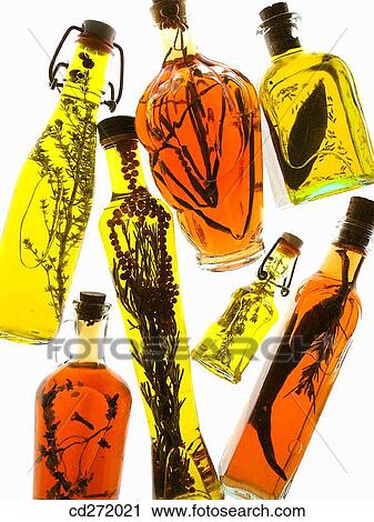 Oil olive and vinegars with aromatic herbs View Large Photo Image Stock Image - Oil olive and vinegars with aromatic herbs. Fotosearch
