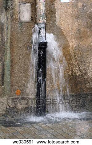 Stock Image - Overflowing gutter during heavy shower, Ratisbone / Regensburg, Upper Palatinate, Bavaria, Germany. Fotosearch