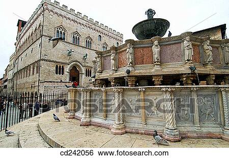 Palazzo dei Priori (aka Palazzo Comunale, town hall) and Fontana Maggiore in Piazza Quattro Novembre. Perugia. Umbria, Italy View Large Photo Image Stock Photograph - Palazzo dei Priori (aka Palazzo Comunale, town hall) and Fontana Maggiore in Piazza Quattro Novembre. Perugia. Umbria, Italy. Fotosearch