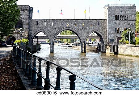 Pont des Trous bridge over Escaut river. Tournai. Hainaut, Belgium View Large Photo Image Stock Photograph - Pont des Trous bridge over Escaut river. Tournai. Hainaut, Belgium. Fotosearch