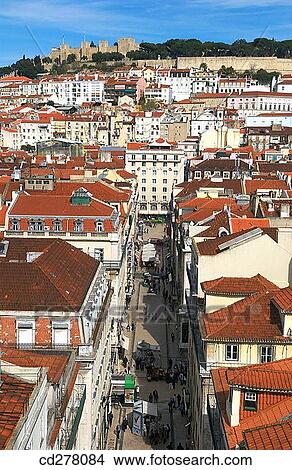 Rua de Santa Justa and St. George's Castle in background, Lisbon. Portugal View Large Photo Image Picture - Rua de Santa Justa and St. George's Castle in background, Lisbon. Portugal. Fotosearch