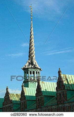 Stock Image - Spire in the form of four intertwined dragons tails on the Borsen, the Old Stock Exchange, Copenhagen, Denmark. Fotosearch