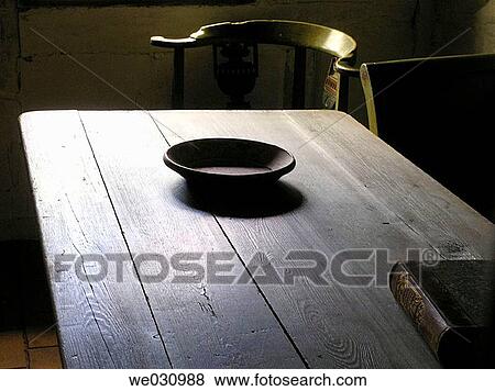Still life with an old wooden bowl on a very old table. Bible on the right on the table View Large Photo Image Stock Photo - Still life with an old wooden bowl on a very old table. Bible on the right on the table. Fotosearch