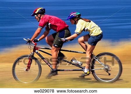Tandem mountain biking View Large Photo Image Stock Photo - Tandem mountain biking. Fotosearch