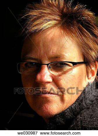 Stock Photo - Thoughtful woman in her fourties. Fotosearch