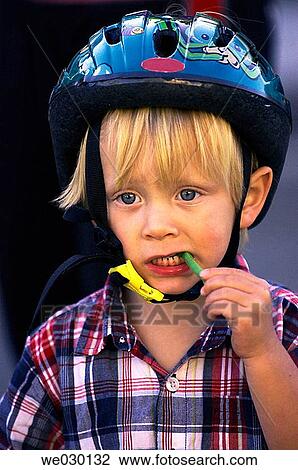 Toddler wearing bike helmet View Large Photo Image Stock Image - Toddler wearing bike helmet. Fotosearch