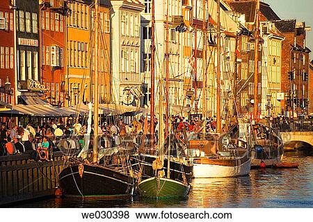 Typical architecture and boats at Nyhavn canal. Copenhagen, Denmark View Large Photo Image Stock Photo - Typical architecture and boats at Nyhavn canal. Copenhagen, Denmark. Fotosearch