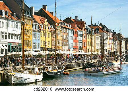 Typical architecture and boats at Nyhavn canal, Copenhagen, Denmark View Large Photo Image Stock Photograph - Typical architecture and boats at Nyhavn canal, Copenhagen, Denmark. Fotosearch