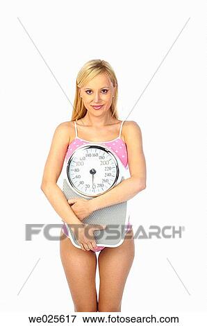 Woman with scale View Large Photo Image Stock Photo - Woman with scale. Fotosearch