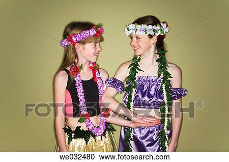 Stock Image - 10 and 11 year old siblings, Polynesian dress. Fotosearch