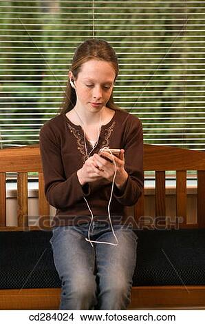 11 year Caucasian girl with iPod View Large Photo Image Picture - 11 year Caucasian girl with iPod. Fotosearch