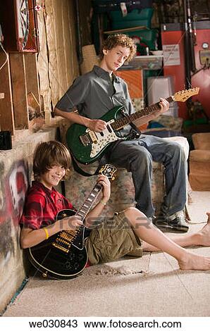 Stock Image - 13 and 15 year old Caucasian brothers. Fotosearch
