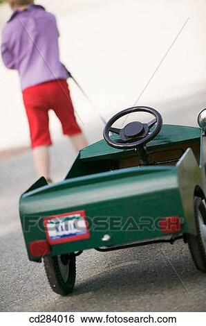 2. 5 Caucasian girl with peddle car View Large Photo Image Stock Photograph - 2. 5 Caucasian girl with peddle car. Fotosearch