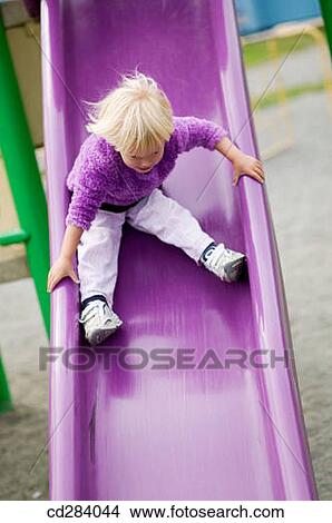 2. 5 year old Caucasian girl on play ground slide View Large Photo Image Picture - 2. 5 year old Caucasian girl on play ground slide. Fotosearch