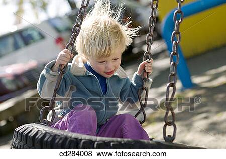 2. 5 year old Caucasian girl on tire swing View Large Photo Image Stock Photo - 2. 5 year old Caucasian girl on tire swing. Fotosearch