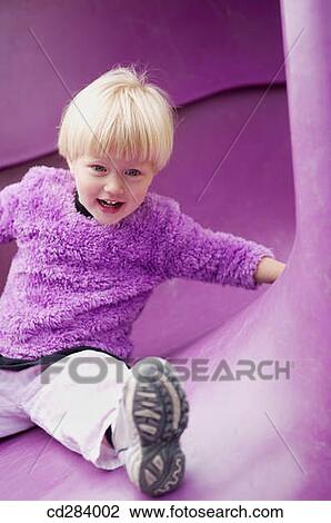 2. 5 yeard old Caucasian girl on play ground slide View Large Photo Image Stock Image - 2. 5 yeard old Caucasian girl on play ground slide. Fotosearch