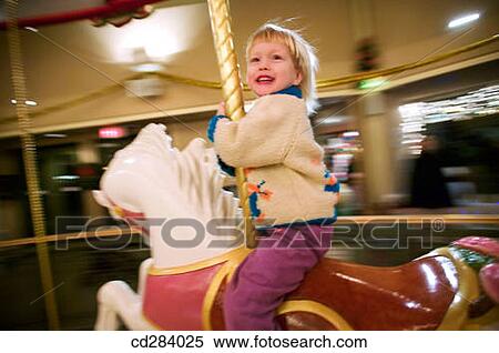 3 year old Caucasian girl on carousel horse View Large Photo Image Stock Photography - 3 year old Caucasian girl on carousel horse. Fotosearch