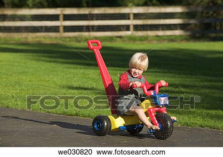 3 year old Caucasian girl on plastic tricycle View Large Photo Image Stock Image - 3 year old Caucasian girl on plastic tricycle. Fotosearch
