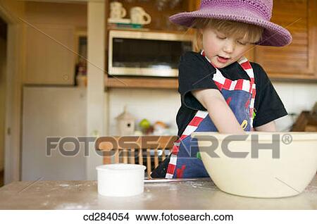 3 year old girl mixing cookie dough View Large Photo Image Picture - 3 year old girl mixing cookie dough. Fotosearch