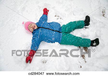 3 year old making snow angel View Large Photo Image Stock Photo - 3 year old making snow angel. Fotosearch