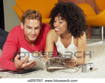 Stock Photo - 30's, browsing, browse, at-home, 20's. Fotosearch