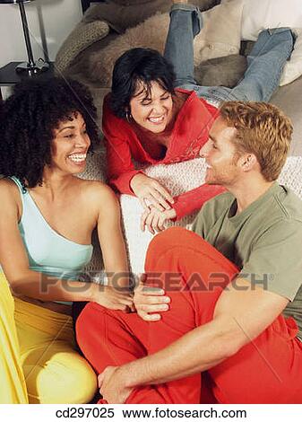 Stock Photography - 30's, chat, at-home, amusement, 20's. Fotosearch